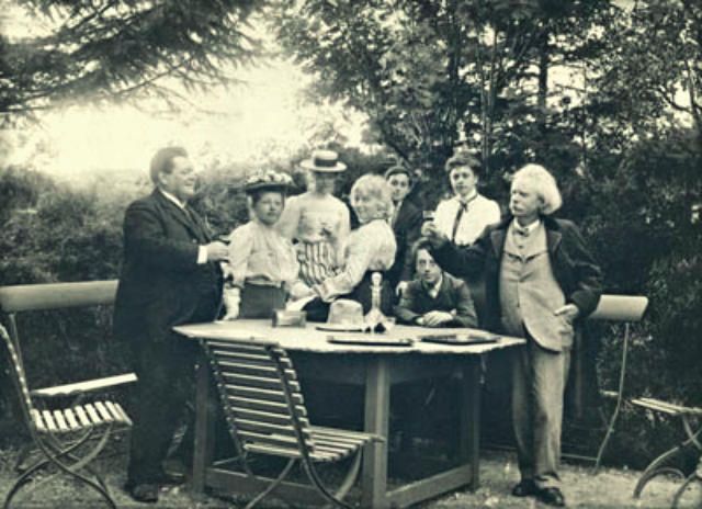 A rare surviving photograph of the Brodskys' visit in the summer of 1906 to Grieg's family home in Troldhaugen, near Bergen. From left to right the figures standing in the foreground are: Adolph Brodsky, his wife Anna, Nina Hagerup Grieg, and Edvard Grieg