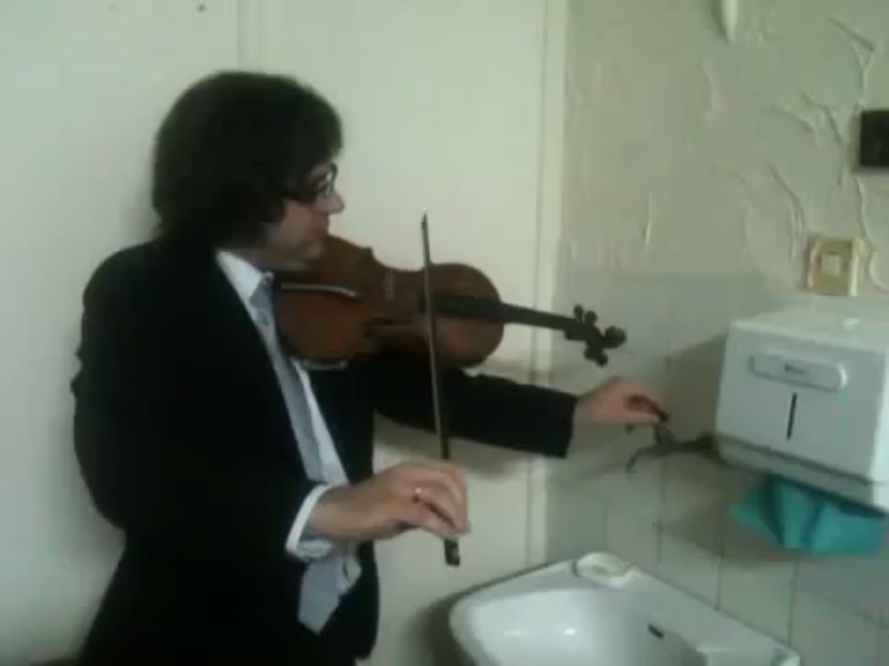 Violinist Plays Along With Broken Water Pipes