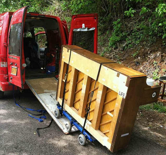 Dotan Negrin transports his piano in a van