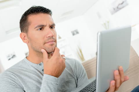 Thinking man with a laptop