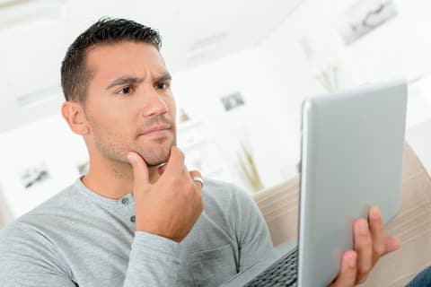 Thinking man with a laptop