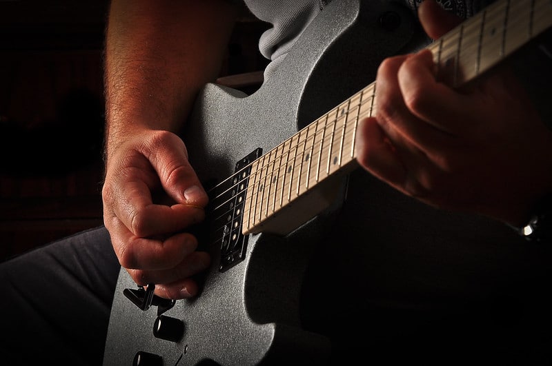 Man playing a guitar