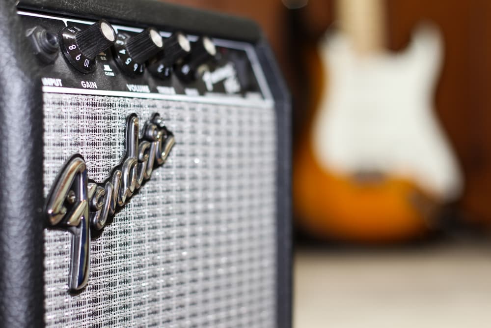 fender amp with guitar behind
