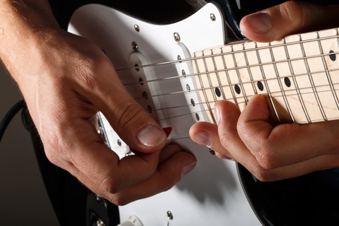 White guitar pickguard