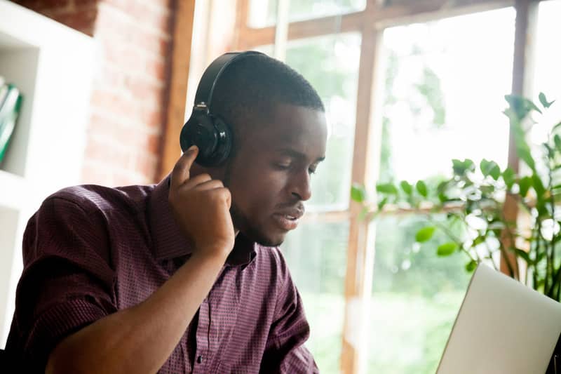 African american man enjoying music in headphones