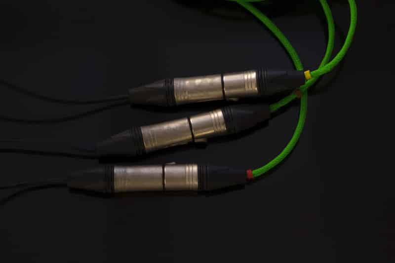 Green of XLR microphone cable on black background