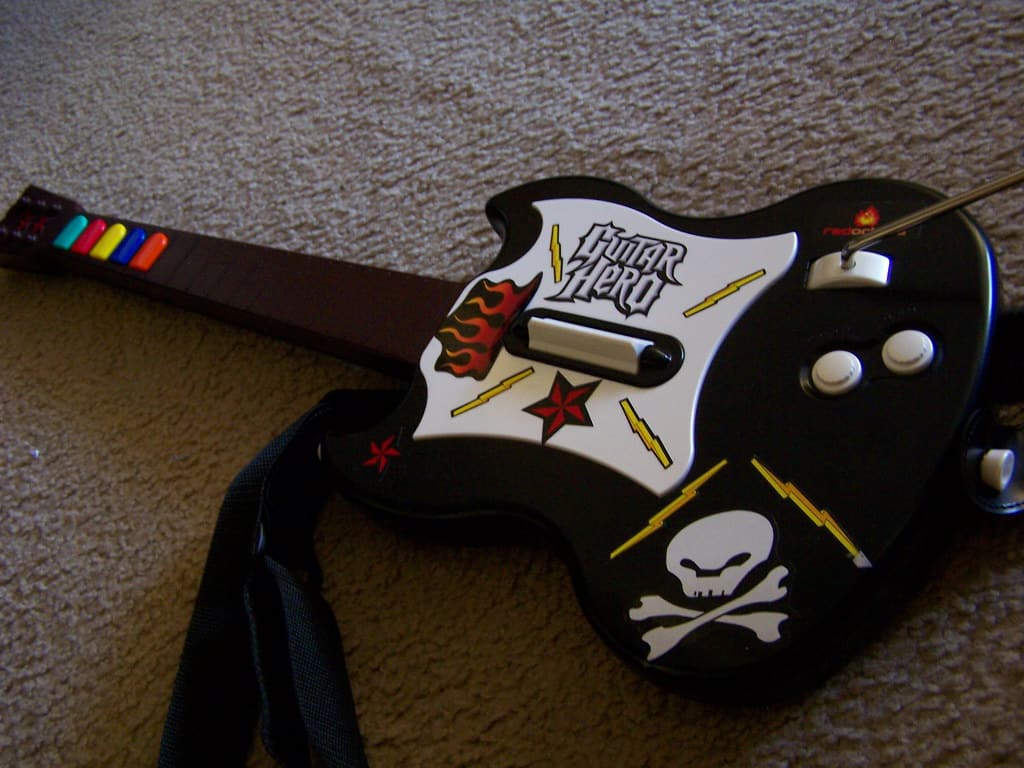 Guitar hero lying on floor