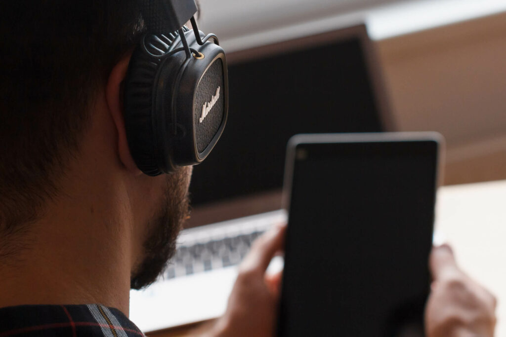 Young man enjoying his favorite music using headphone