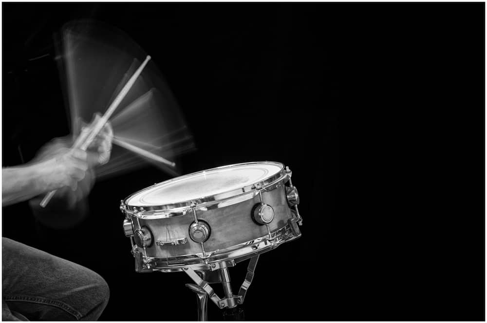 Action shot of a drummer hitting a snare drum with motion blur 
