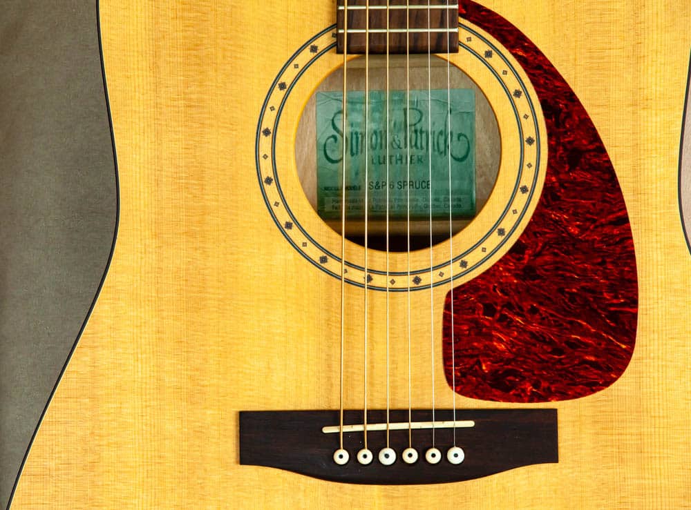 Close-up of a Simon and Patrick acoustic guitar