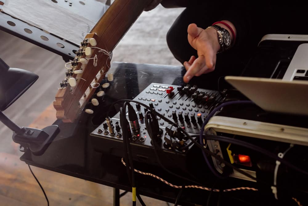 Male musician doing technical preparation for live concert