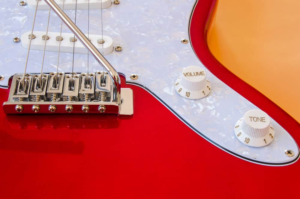 Part of a red and white electric guitar 