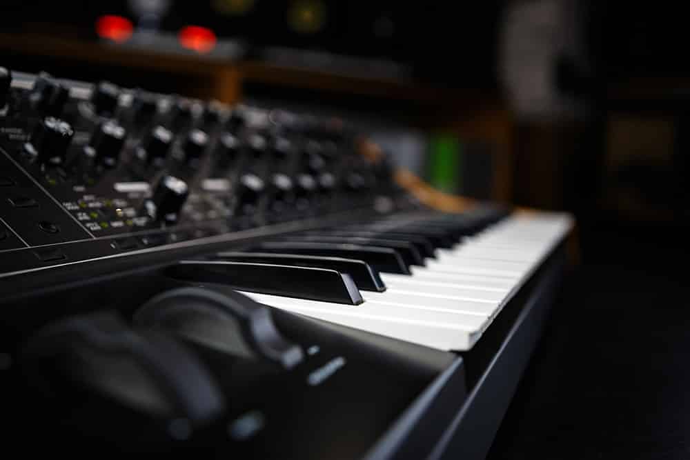 Professional analog synth device with classic pianist keyboard and regulators
