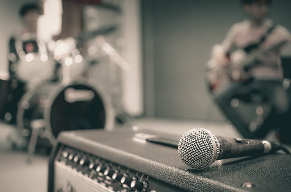 Closeup of microphone on musician blurred background