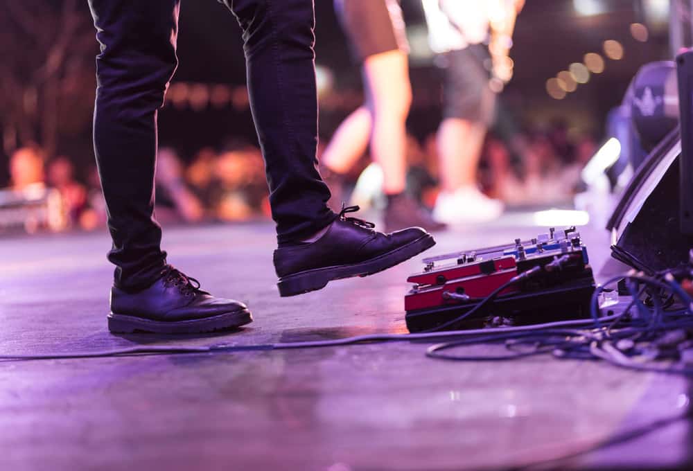 Electric bass guitar player on a stage