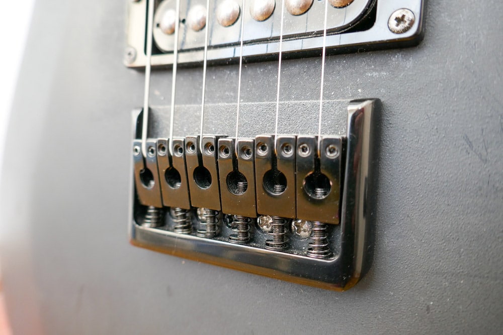 Guitar bridge on acoustic or electric guitar