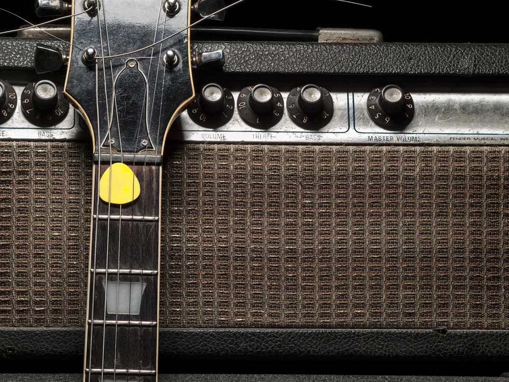 worn electric guitar and amplifier