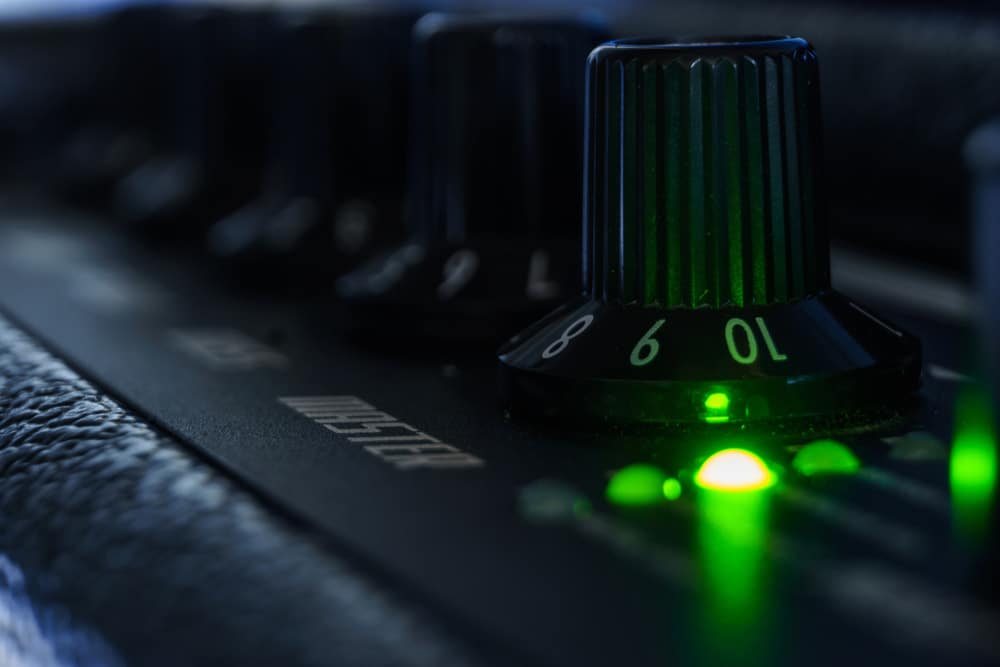 Detail of an amplifier for electric guitar with green lights