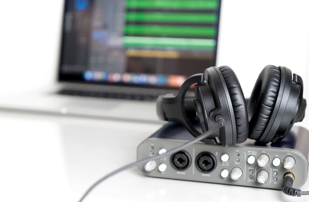 Black Music Studio headphone lying on sound interface