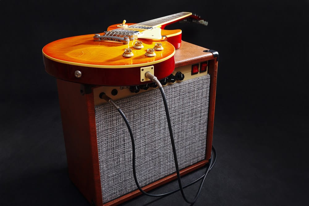 Brown guitar amplifier with honey sunburst guitar