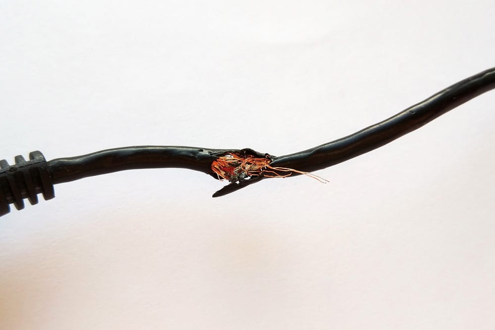 Damaged black electric cord