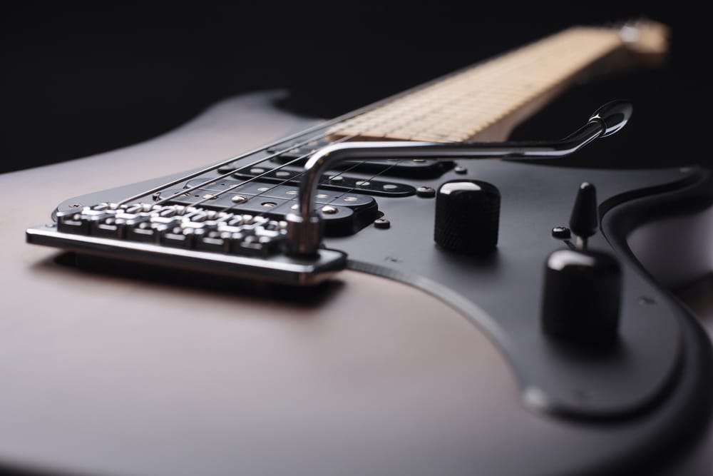 Elegant electric guitar on black background 