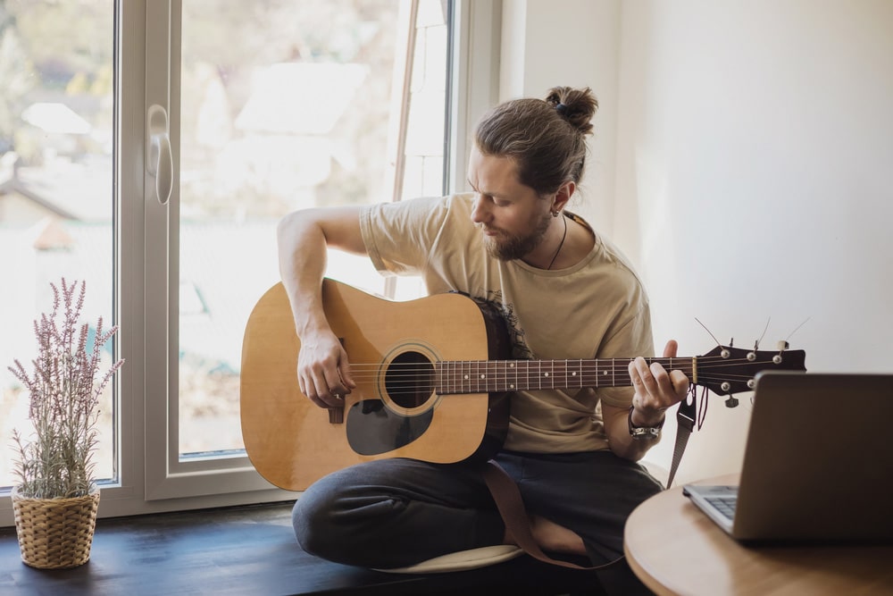 Man playing the acoustic guitar