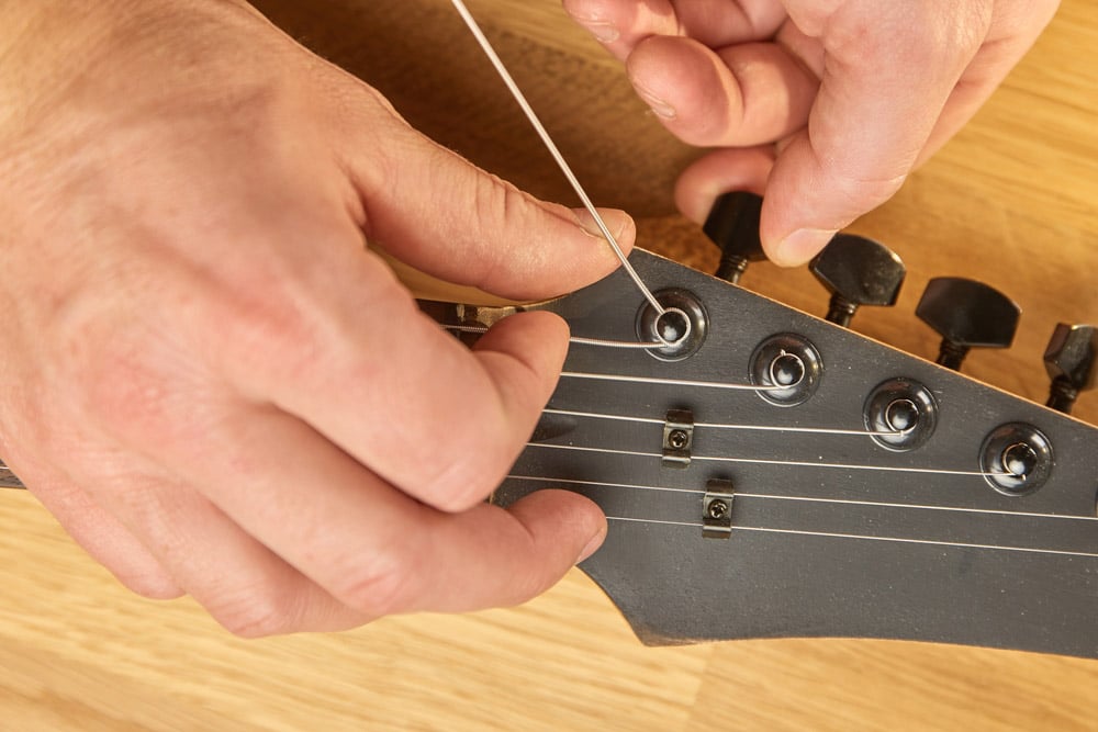 Putting new string on an electric guitar
