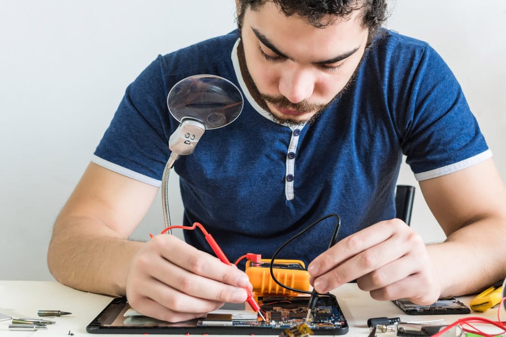 Repairman testing electric circuit