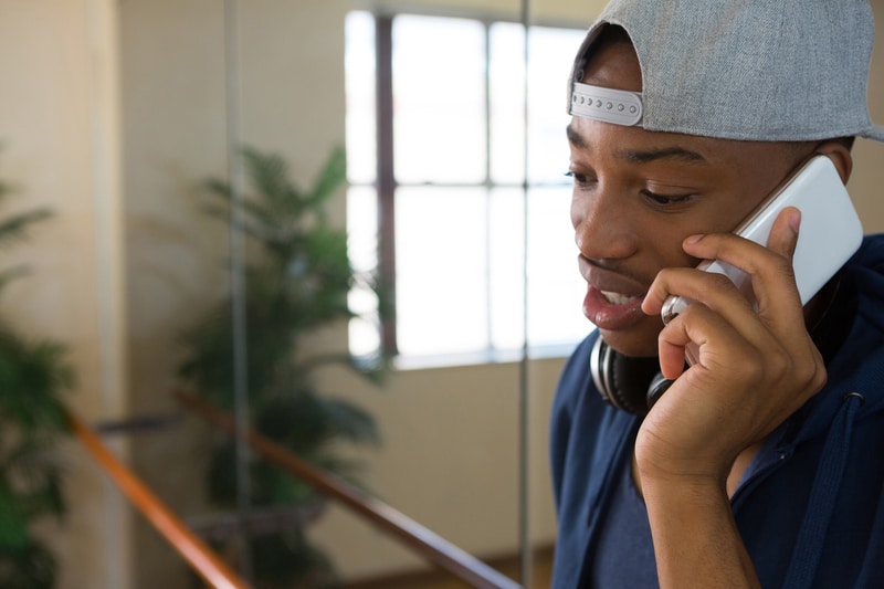 Man talking on mobile phone in studio