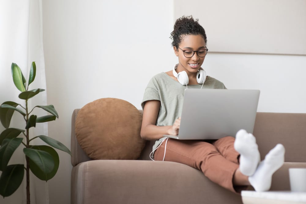 Young woman student using laptop 