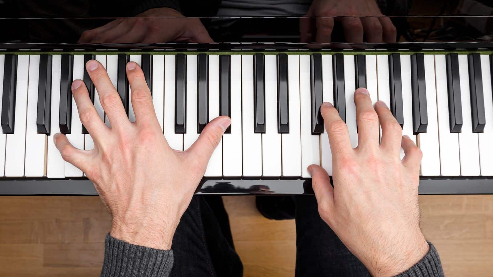 Hands playing piano